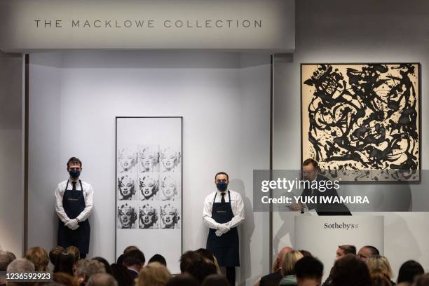 Sotheby's auctioneer Oliver Barker leads an auction of The Macklowe Collection, alongside Andy Warhol's "Nine Marilyns" sold for $47 000 and Jackson...