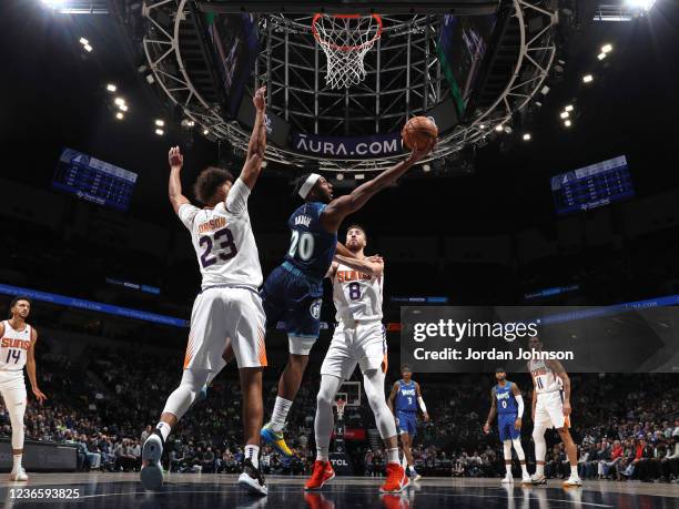 Josh Okogie of the Minnesota Timberwolves drives to the basket against the Phoenix Suns on November 15, 2021 at Target Center in Minneapolis,...