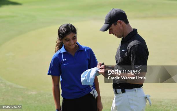 Rory McIlroy of Northern Ireland with playing partner Alayna Rafique , during the Pro-Am at The DP World Tour Championship at Jumeirah Golf Estates...