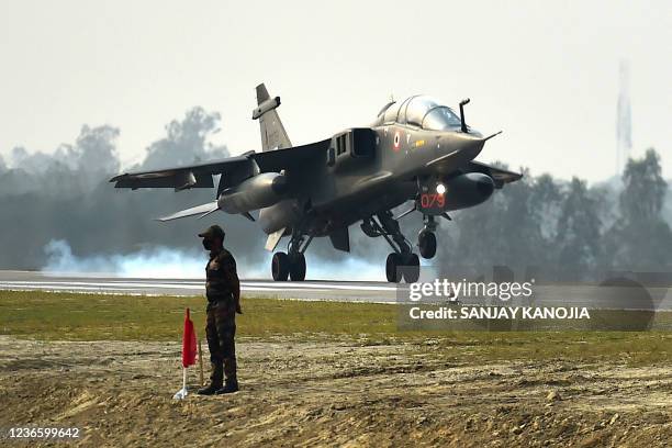 An Indian Air Force fighter jet touches down at the new Purvanchal Expressway in Sultanpur district in Uttar Pradesh state on November 16 during a...