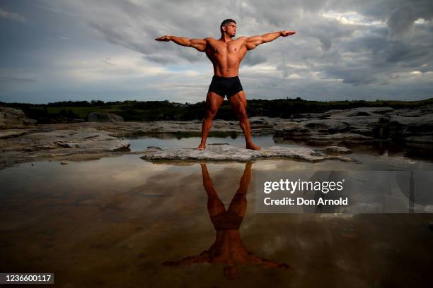 Chris Kavvalos poses during an early morning photo shoot at Little Bay on May 31, 2020 in Sydney, Australia. IFBB body builder Chris Kavvalos has...