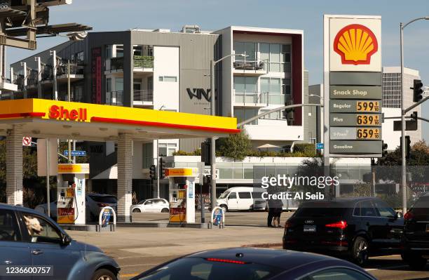 Drivers select from various fuels priced near of above over $6 dollars at a Shell gas station located at South Fairfax, West Olympic and San Vicente...