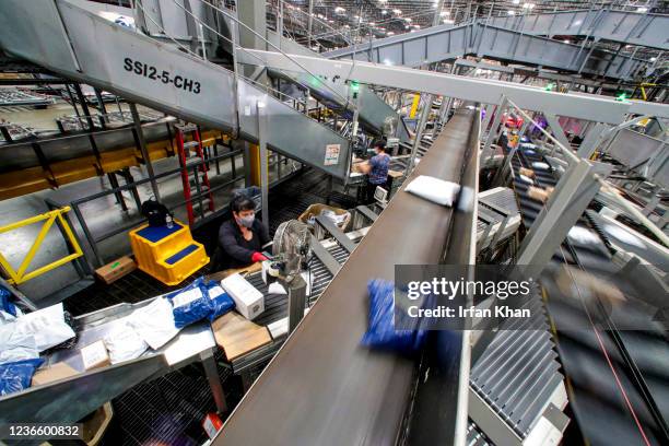 Ontario, CA Conveyors belts carrying packages for sorting and delivery snake through the UPS West Coast Region Air Hub on Tuesday, Nov. 2, 2021 in...