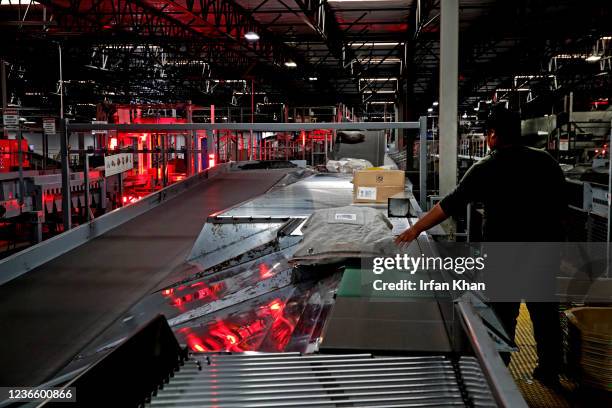 Ontario, CA Packages on the conveyors on the way for barcode scanning at the UPS West Coast Region Air Hub on Tuesday, Nov. 2, 2021 in Ontario, CA.