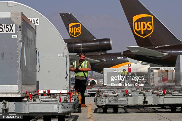 Ontario, CA Chris Elton scans a shipping bin at the UPS West Coast Region Air Hub on Tuesday, Nov. 2, 2021 in Ontario, CA.