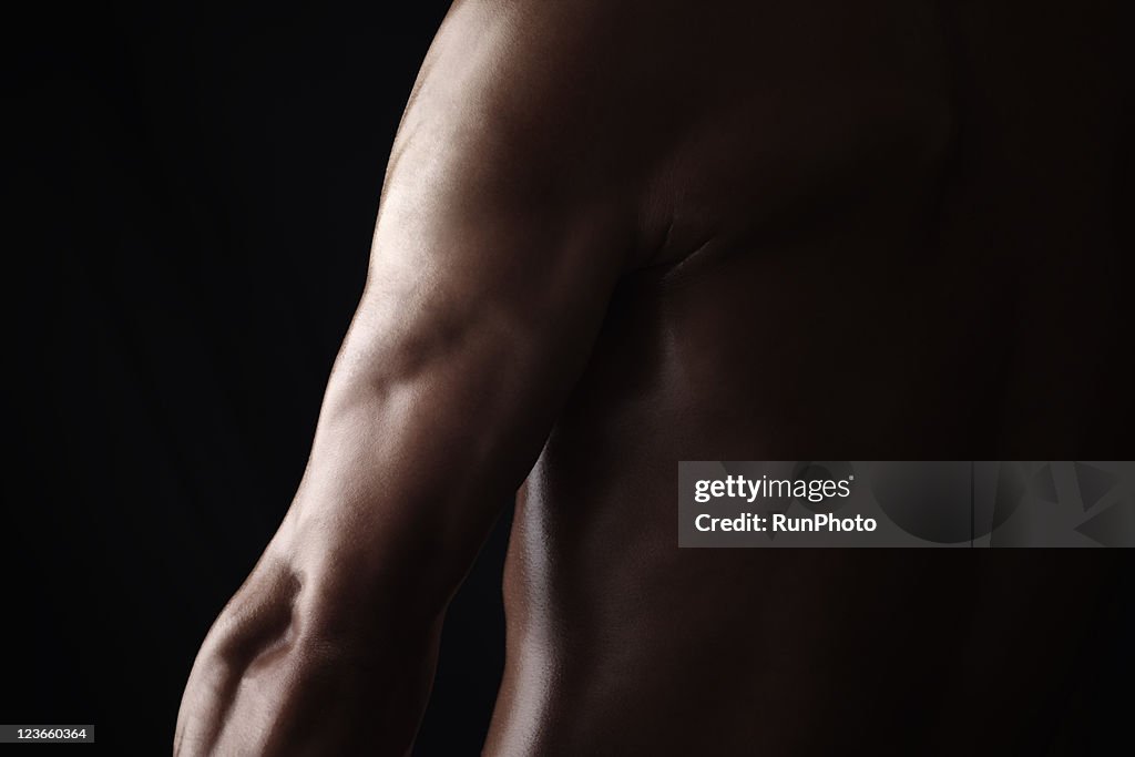 Young muscular man,upper arm