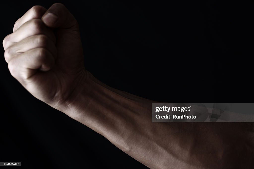 Young muscular man,arm close-up