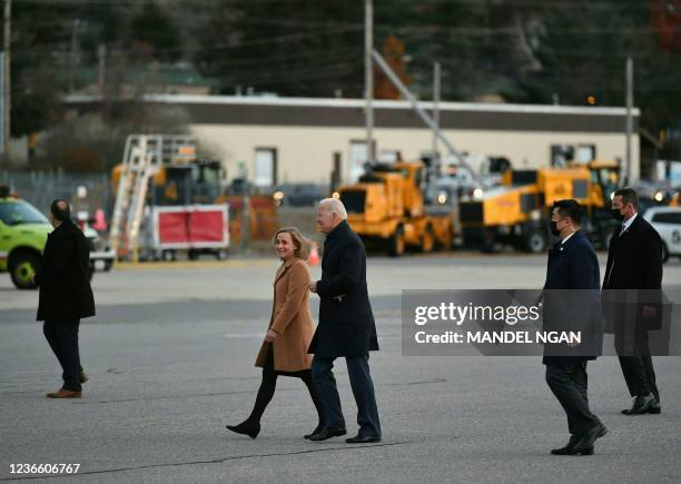 President Joe Biden walks with Manchester Mayor Joyce Craig before boarding Air Force One at Manchester-Boston Regional Airport in Manchester, New...