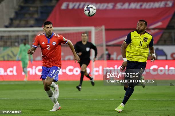 Chile's Guillermo Maripan and Ecuador's Michael Estrada vie for the ball during their South American qualification football match for the FIFA World...