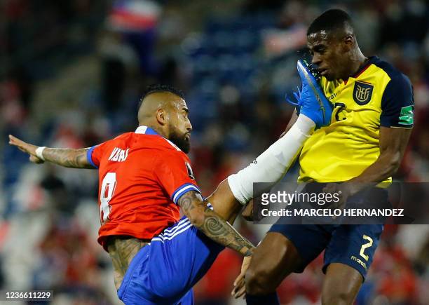 Chile's Arturo Vidal kicks Ecuador's Felix Torres during their South American qualification football match for the FIFA World Cup Qatar 2022 at the...