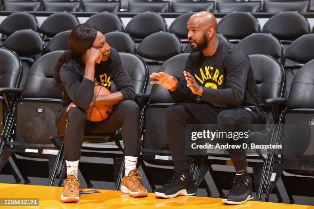 Associate Coach Shay Murphy and Assistant Coach John Lucas III of the Los Angeles Lakers talk before the game on October 22, 2021 at STAPLES Center...