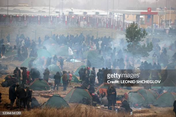 Migrants aiming to cross into Poland are seen in a camp near the Bruzgi-Kuznica border crossing on the Belarusian-Polish border on November 17, 2021....