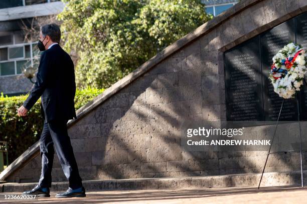 Secretary of State Antony Blinken puts a wreath down at the August 7 Memorial in Nairobi, Kenya, on November 17 which is one of the sites of the 1998...