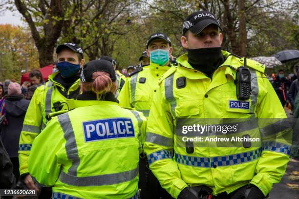 Heavy policing around members of the Young Communist League who joined thousands of demonstrators gathered to walk through the city during the COP26...