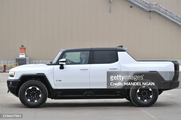 President Joe Biden test drives an electric Hummer as he tours the General Motors Factory ZERO electric vehicle assembly plant in Detroit, Michigan...