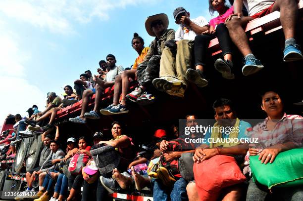 Migrants who where heading in a caravan to the US, travel in a truck in Nuevo Morelos, Jesus Carranza municipality, Veracruz state, Mexico, on...