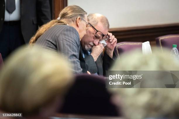 Greg McMichael wipes his eyes during a recess in the testimony of his son Travis McMichael during their trial in the Glynn County Courthouse on...