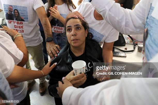 Israeli Natalie Oknin, who was held with her husband in Turkey for a week on suspicion of espionage, is greeted upon her arrival home in the Israeli...