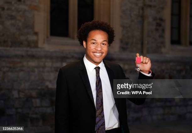 Sheku Kanneh-Mason is made a MBE by the Princess Royal during an Investiture Ceremony at Windsor Castle on November 17, 2021 in Windsor, England.