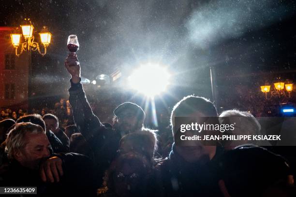 Participants take part in the traditional event "the Sarmentelles" announcing the beginning of the "Beaujolais Nouveau" 2021 wine edition, in the...