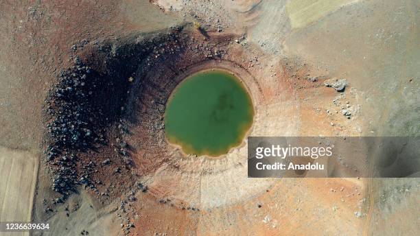 Drone photo shows a giant sinkhole appeared on the peninsula with the withdrawal of Keban Dam Lake waters due to drought at Agin district in Elazig,...