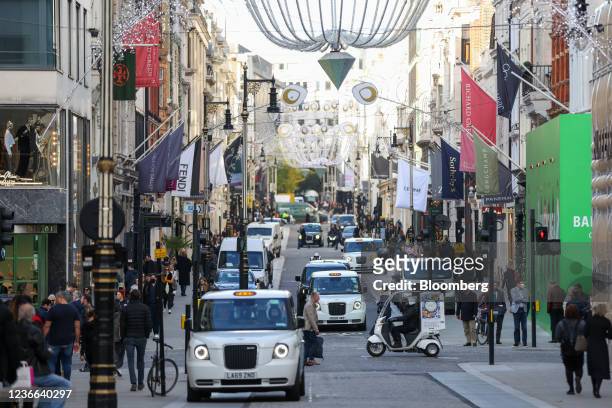 Pedestrians pass luxury shops on New Bond Street in London, U.K., on Wednesday, Nov. 17, 2021. The U.K. Office for National Statistics are due to...