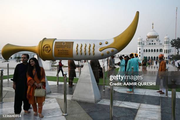 Sikh pilgrims arrive to take part in a religious ritual on the eve of the birth anniversary of Guru Nanak, founder of Sikhism, at the Gurdwara Darbar...