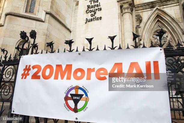 Disabled People Against Cuts banner is pictured outside the Royal Courts of Justice before a High Court challenge by four claimants against the...