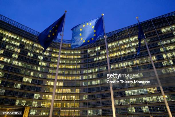 The EU flag is seen in front of the Berlaymont, the EU Commission headquarters, on November 18, 2021 in Brussels, Belgium.