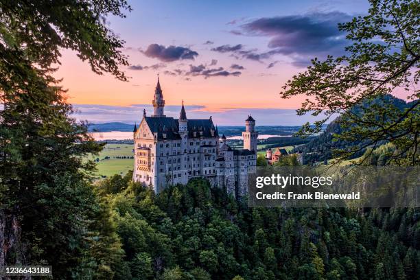 Panoramic view of the castle Neuschwanstein at sunset.