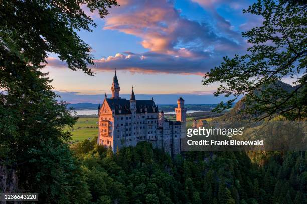 Panoramic view of the castle Neuschwanstein at sunset.
