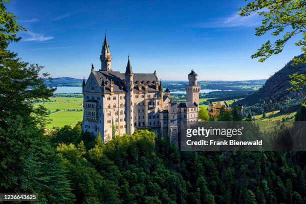 Panoramic view of the castle Neuschwanstein after sunrise.