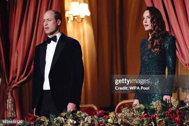 Prince William, Duke of Cambridge and Catherine, Duchess of Cambridge sing the national anthem as they attend the Royal Variety Performance at Royal...