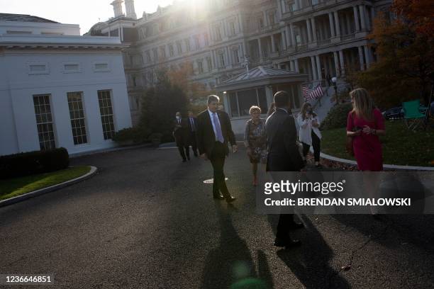 Director of the White House National Drug Control Policy Rahul Gupta and US Senator Joe Manchin III walk the grounds of the White House, November 18...
