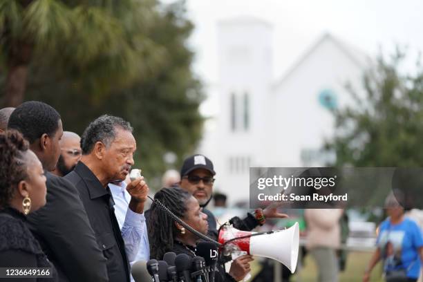 Rev. Jesse Jackson speaks to demonstrators at the Glynn County Courthouse after the adjournment of daily court proceedings in the trial for the...