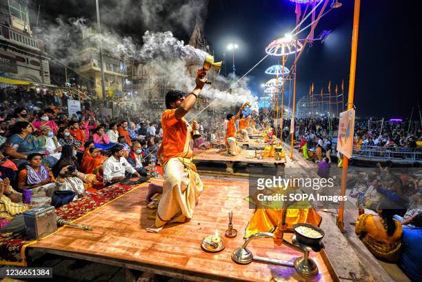 Hindu Priests performing Evening Aarati at Dashashwamedh Ghat, during the Ganga Aarti, a traditional and old Hindu ritual honouring the Ganges River...
