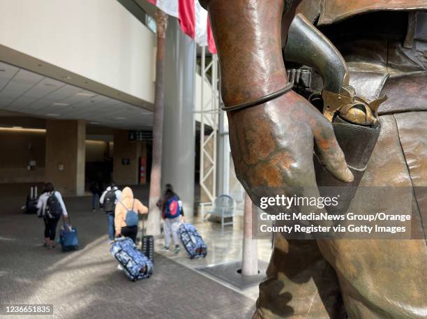 Santa Ana, CA A statue of John Wayne stands at the airport named for him in Santa Ana, CA, on Thursday, November 18, 2021. The number of airline...