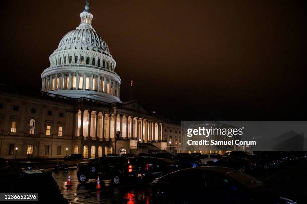 Vehicles of representatives fill the East Front of the U.S. Capitol Building as Democrats attempt to hold a vote on the Build Back Better legislation...