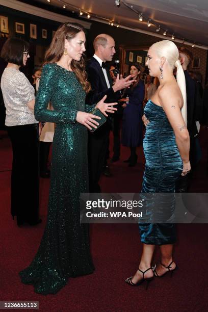 Catherine, Duchess of Cambridge speaks to singer Anne-Marie after watching the Royal Variety Performance at Royal Albert Hall on November 18, 2021 in...