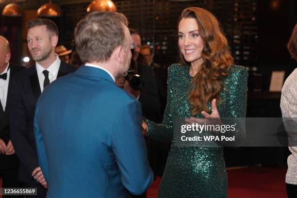 Catherine, Duchess of Cambridge speaks to comedian Chris McCausland after watching the Royal Variety Performance at Royal Albert Hall on November 18,...