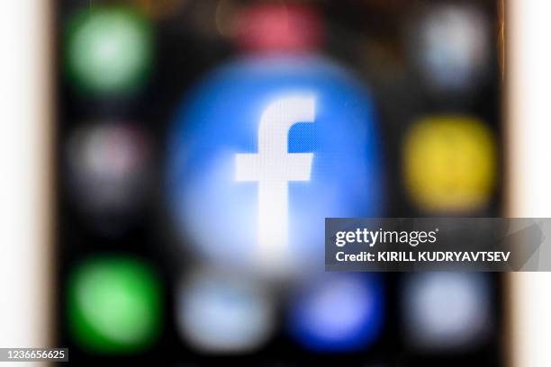 Picture taken on November 19 shows the US online social media and social networking service Facebook's logo on a smartphone screen in Moscow.