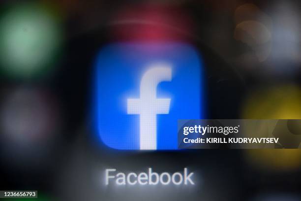 Picture taken on November 19 shows the US online social media and social networking service Facebook's logo on a smartphone screen in Moscow.