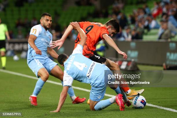 Luke Ivanovic of Brisbane Roar and Nuno Reis of Melbourne City FC contest the ball during the round 1 A-League soccer match between Melbourne City FC...