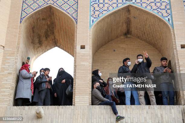 Iranians gather during a protest to voice their anger after their province's lifeblood river dried up due to drought and diversion, in the central...