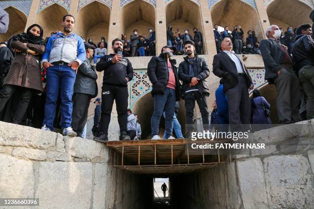 Iranians gather during a protest to voice their anger after their province's lifeblood river dried up due to drought and diversion, in the central...