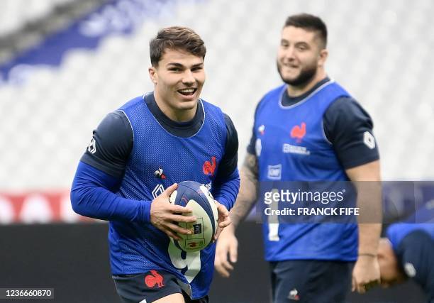 France's scrum half Antoine Dupont plays the ball during a captain's run at the Stade de France in Saint-Denis, outside Paris, on November 19 on the...