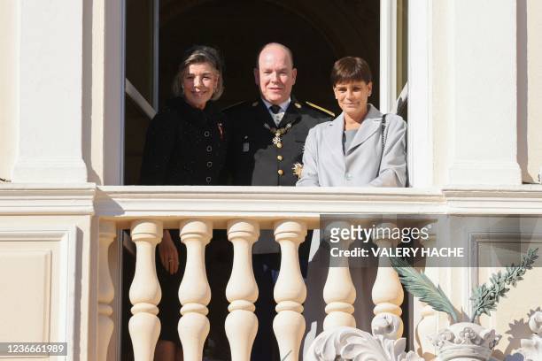 Prince Albert II of Monaco , Princess Caroline of Hanover and Princess Stephanie of Monaco appear at the balcony of Monaco Palace during the...