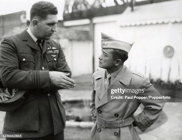 American Olympic gold-medalist diver and physician Sammy Lee, a major in the US Army Medical Corps , with a Canadian wing commander in charge of a...