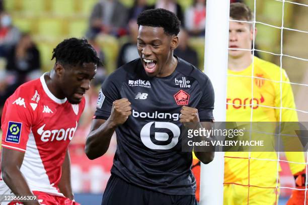 Lille's Canadian forward Jonathan David celebrates after scoring a goal a penalty during the French L1 football match between AS Monaco and Lille at...