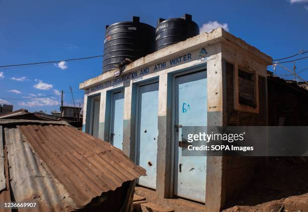 Doors of the local community public toilets are pictured closed in Kibera. World Toilet Day is an official United Nations international observance...